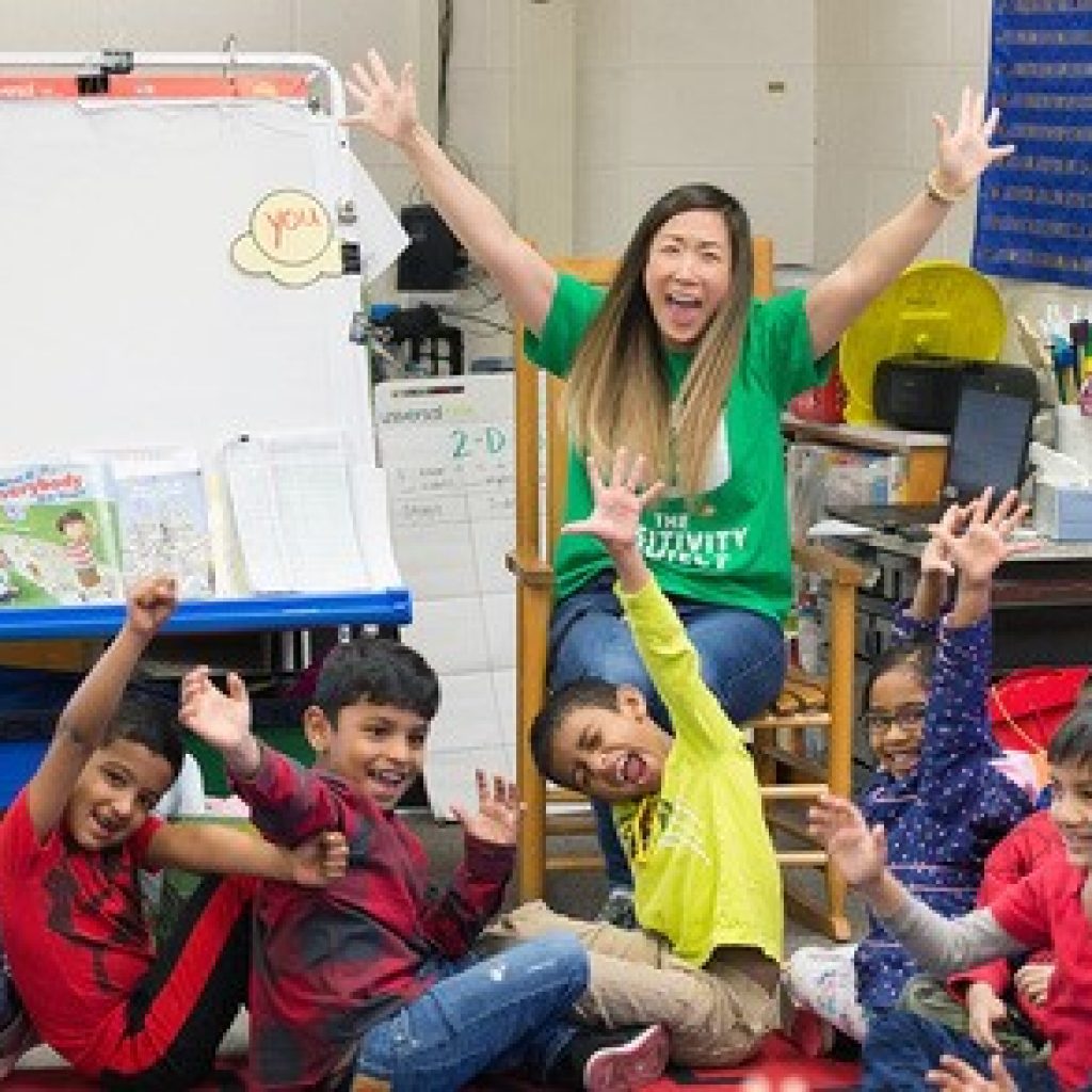 excited teacher with students