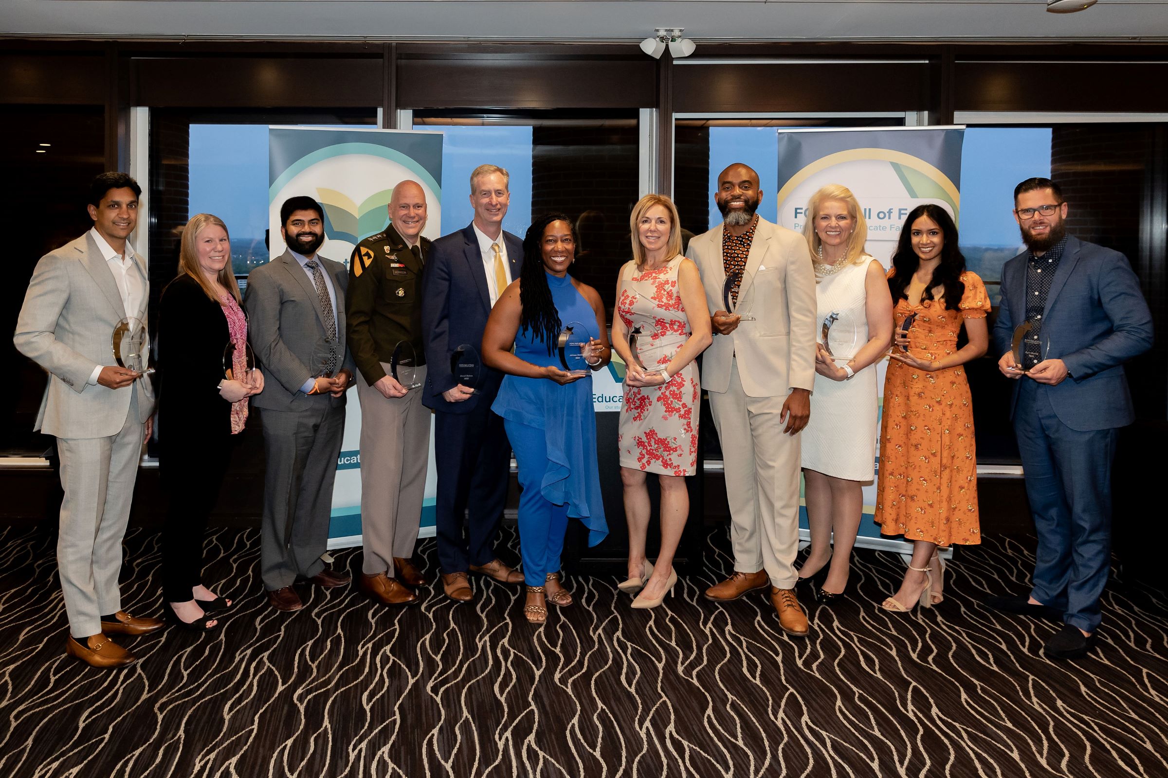 From left:  Dr. Ravi Gupta, Harmonie Taddeo, Gen. John B. Morrison, Jr., David Bulova, Dr. Adriane Randolph, Karen Joseph, Albert Lawrence, Jr., Kathryn Falk, Shriya Boppana, Kore Bendix