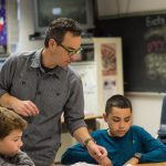 Photo of male teacher with students